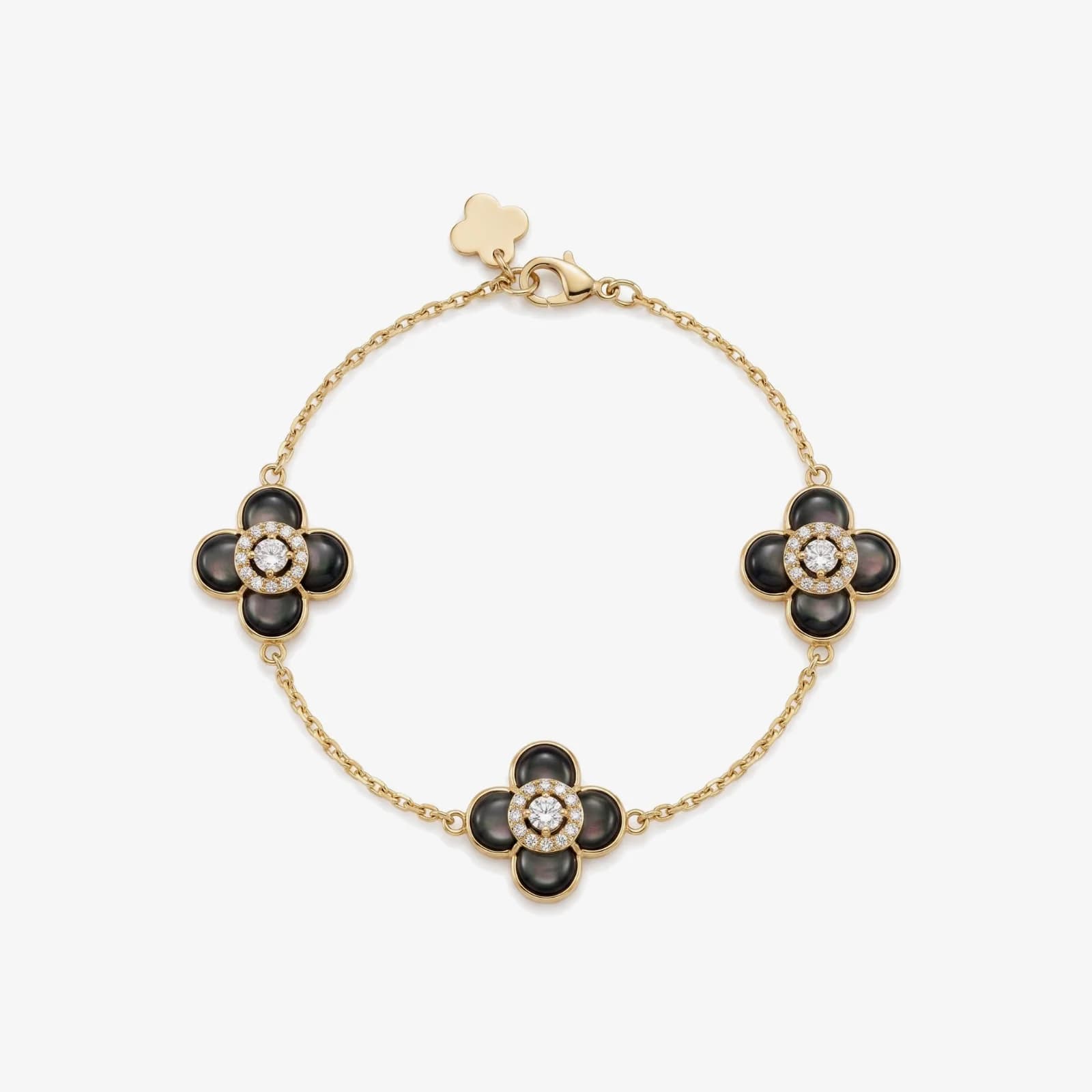 Blossom Bracelet، دستبند زنجیری طلای زرد ۱۸ عیار با سه گل چهارپر صدف خاکستری، حلقه‌شده از بالا